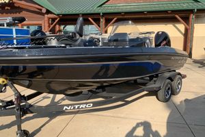 Nitro ZV20 2025 Nitro ZV20 boat on trailer, black exterior, parked outdoors.