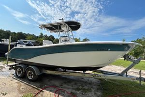 Sea Fox 256 Center Console 2008 Sea Fox 256 Commander boat on trailer under blue sky.