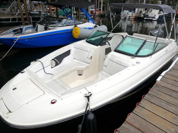 Sea Ray 240 Sundeck Outboard 2014 Sea Ray 240 Sundeck Outboard boat docked at marina.