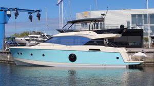Beneteau Monte Carlo 6 2015 Beneteau Monte Carlo 6 yacht docked at marina, featuring sleek design and turquoise hull.