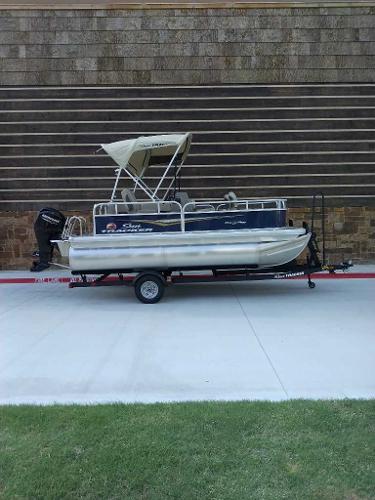 Sun Tracker Bass Buggy 16 XL Select 2025 Sun Tracker Bass Buggy 16 XL Select pontoon boat on trailer.