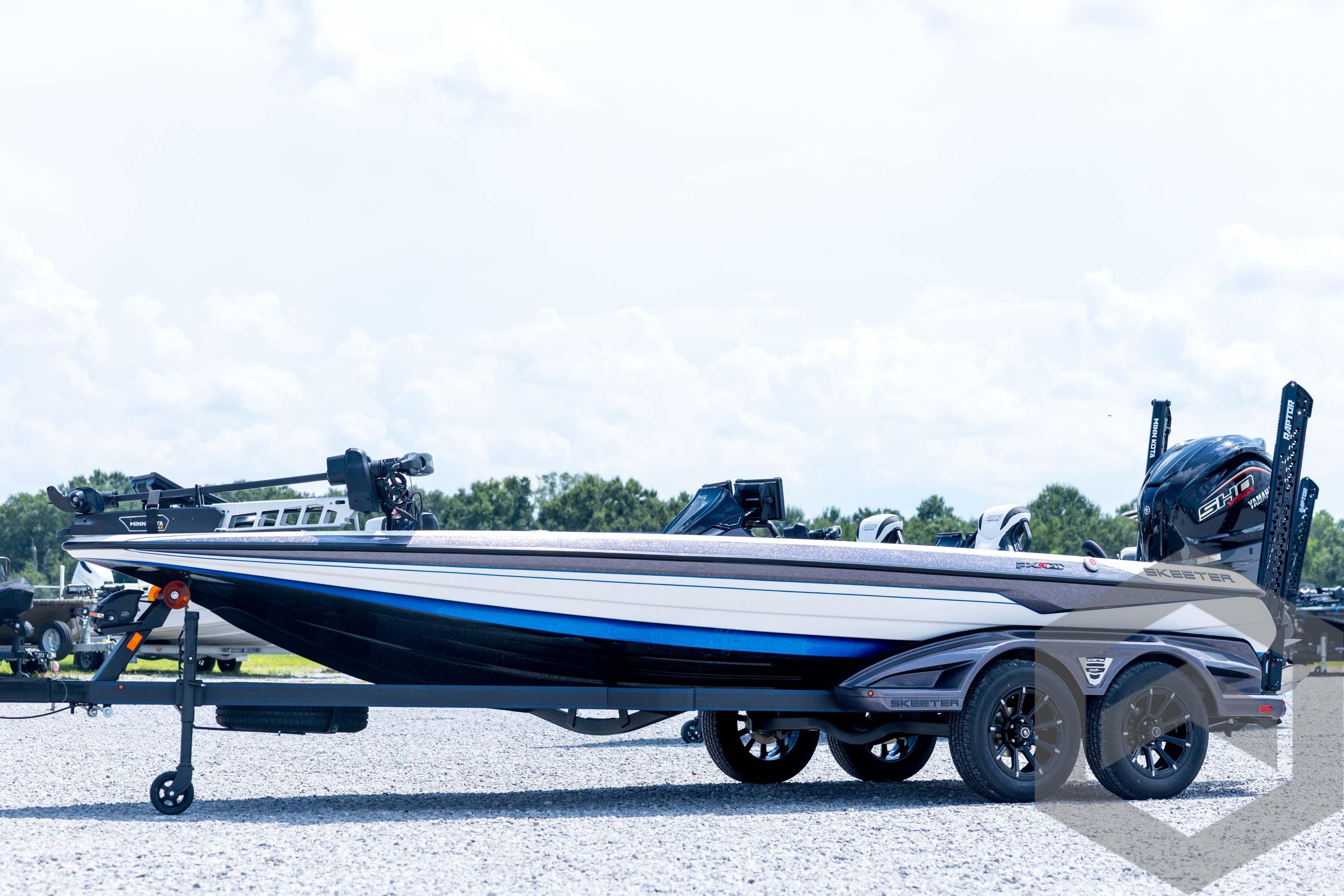 Skeeter FXR21 FLEX 2026 Skeeter FXR21 FLEX boat on trailer, side view, outdoors.