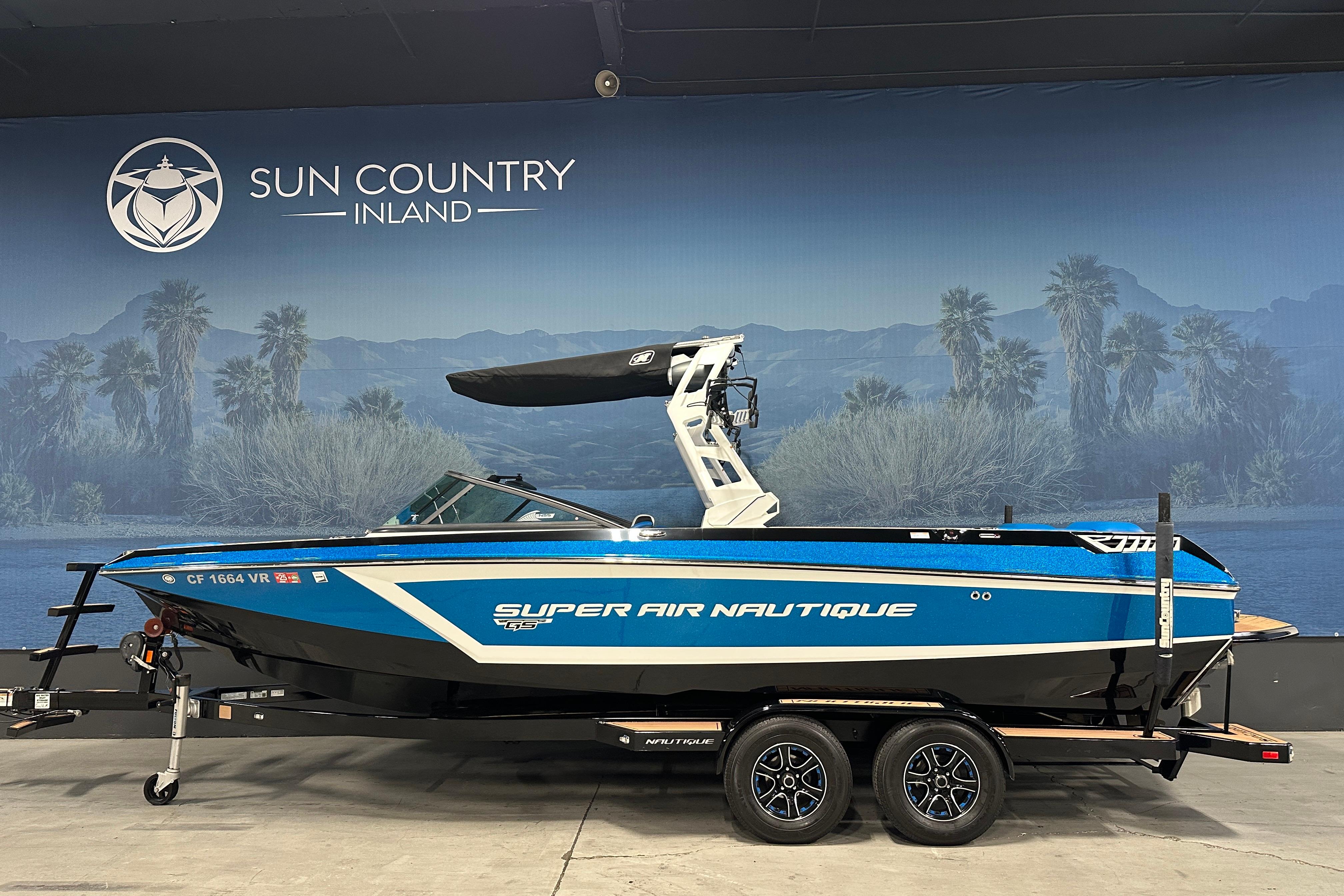 Nautique Super Air Nautique GS24 2018 Nautique Super Air Nautique GS24 boat on trailer, displayed indoors.