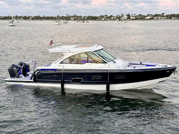 Formula 380 Super Sport Crossover OB 2024 Formula 380 Super Sport Crossover OB cruising on a calm waterway.