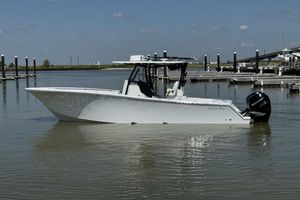 Onslow Bay 33 TE 2022 Onslow Bay 33 TE boat in calm marina waters, side view.