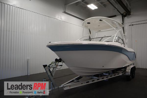 Sea Fox 228 Traveler 2025 Sea Fox 228 Traveler boat on trailer in indoor showroom.