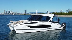 Aquila 36 Sports Yacht 2019 Aquila 36 Sports Yacht on water with city skyline in background.