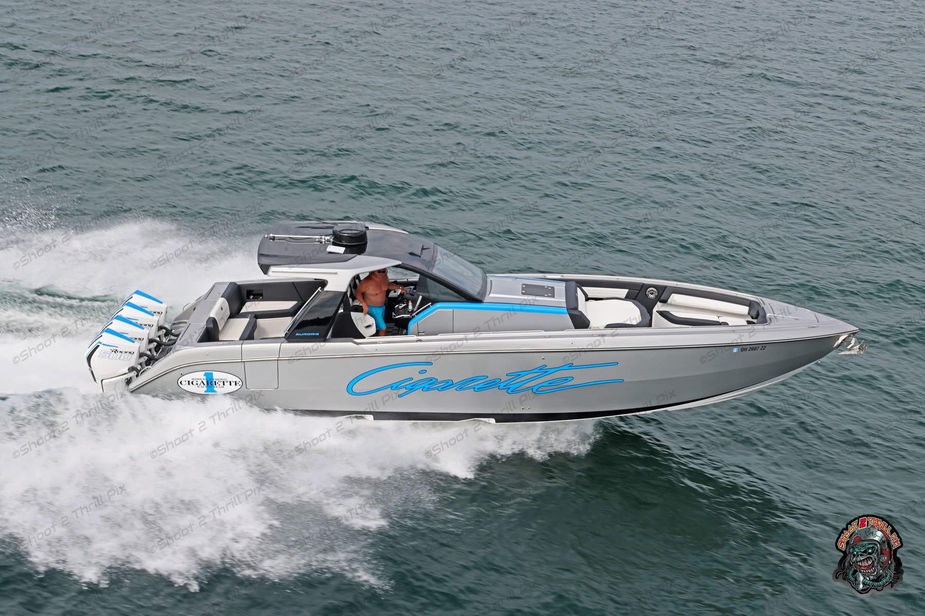 Cigarette 42 Auroris 2024 Cigarette 42 Auroris speedboat cruising on water, showcasing sleek design and powerful engines.
