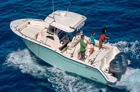 Grady-White Canyon 326 2025 Grady-White Canyon 326 boat cruising on blue ocean waters.