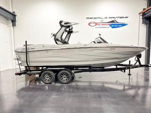 Centurion Nv233 2025 Centurion NV233 boat on trailer in showroom, side view.