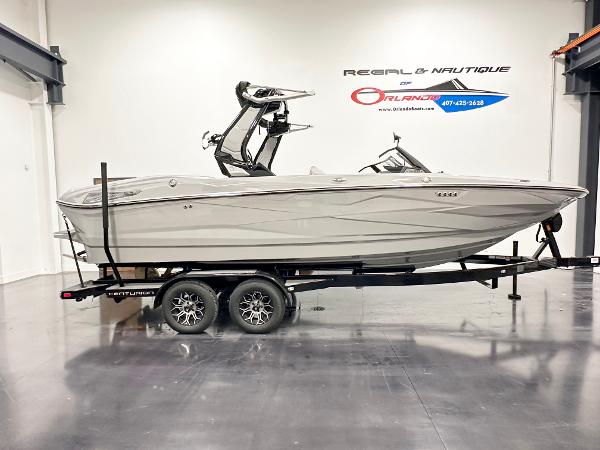 Centurion Nv233 2025 Centurion NV233 boat on trailer in showroom, side view.