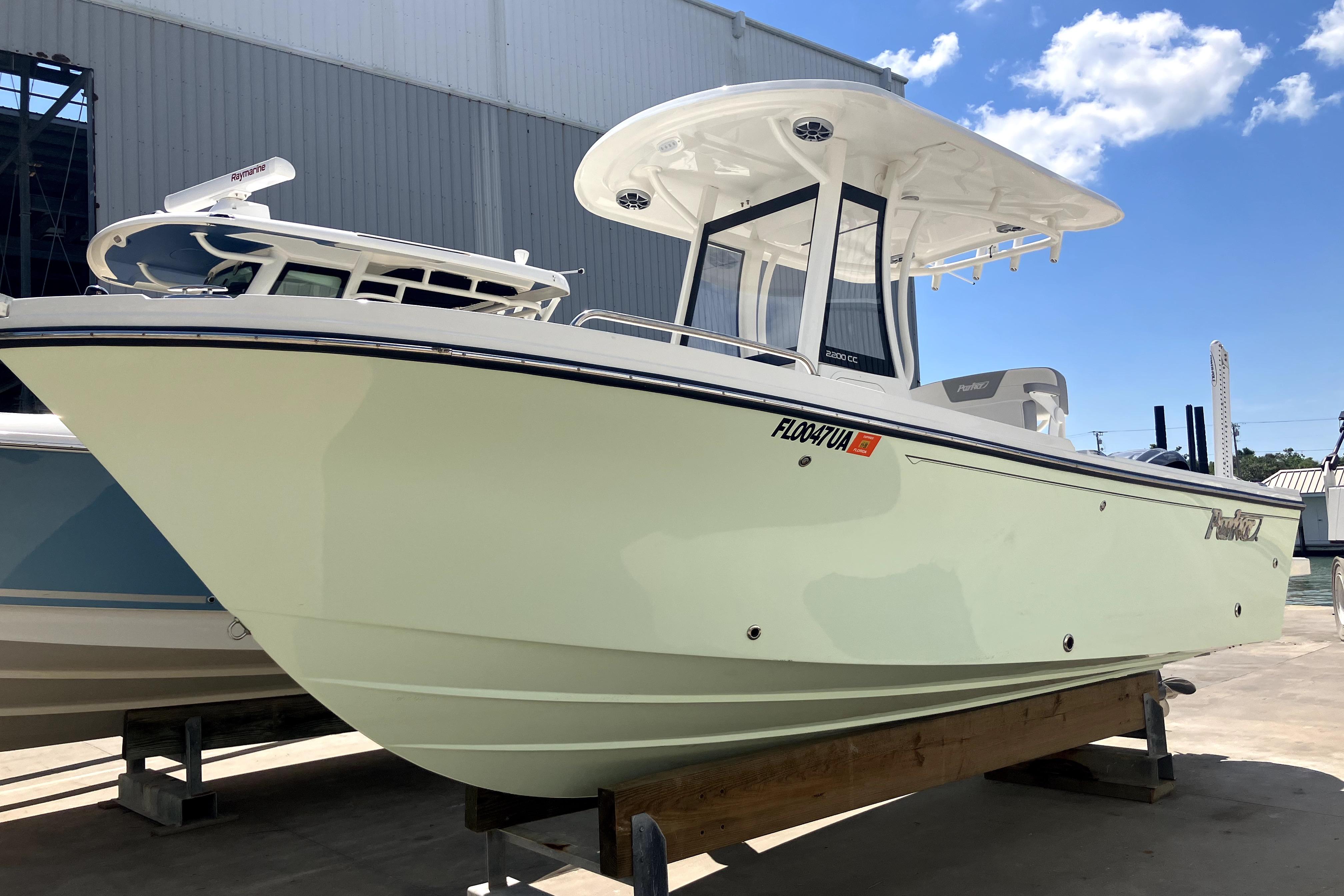 Parker 2200 Center Console 2024 Parker 2200 Center Console boat on display under a clear blue sky.
