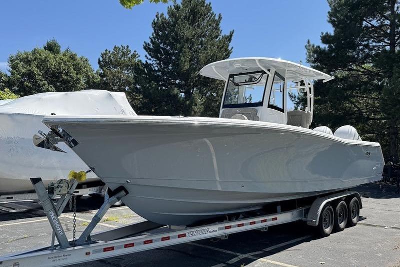 Sea Hunt Gamefish 30 Forward Seating 2026 Sea Hunt Gamefish 30 Forward Seating boat on a trailer, parked outdoors.