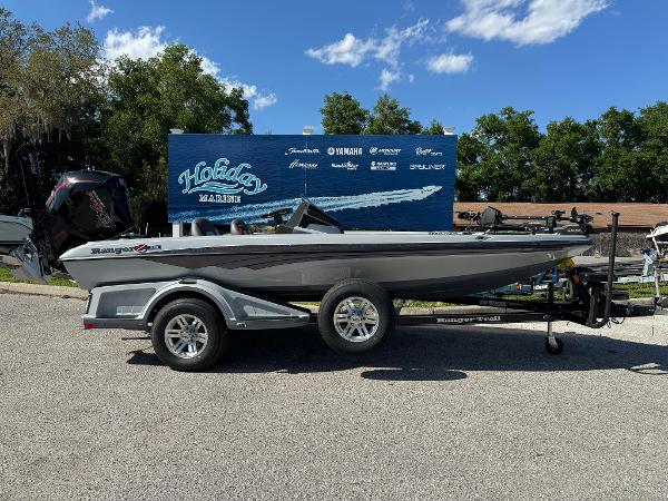 Ranger 518 Cup 2024 Ranger 518 Cup boat on trailer, parked outdoors with a blue sky backdrop.