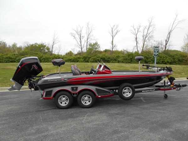 Ranger Z520R 2023 Ranger Z520R bass boat on trailer, black and red, side view.