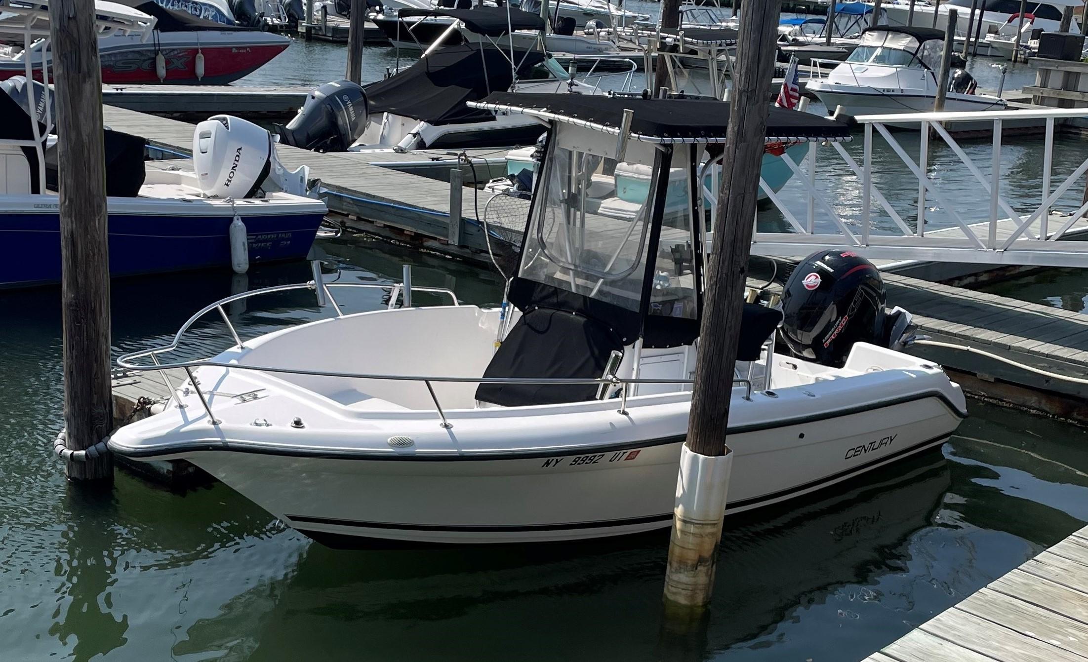 Century 2000 Center Console Century 2000 Center Console boat docked at marina, 2000 model year.