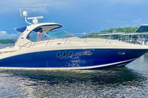 Sea Ray 38 Sundancer 2007 Sea Ray 38 Sundancer yacht on calm water, blue and white design, sunny day.