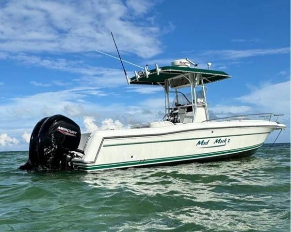 Stamas 250 Tarpon 2000 Stamas 250 Tarpon boat on water, clear sky, Mercury engine visible.