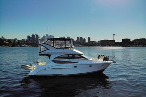 Meridian 341 Sedan 2008 Meridian 341 Sedan yacht on water with city skyline in background.