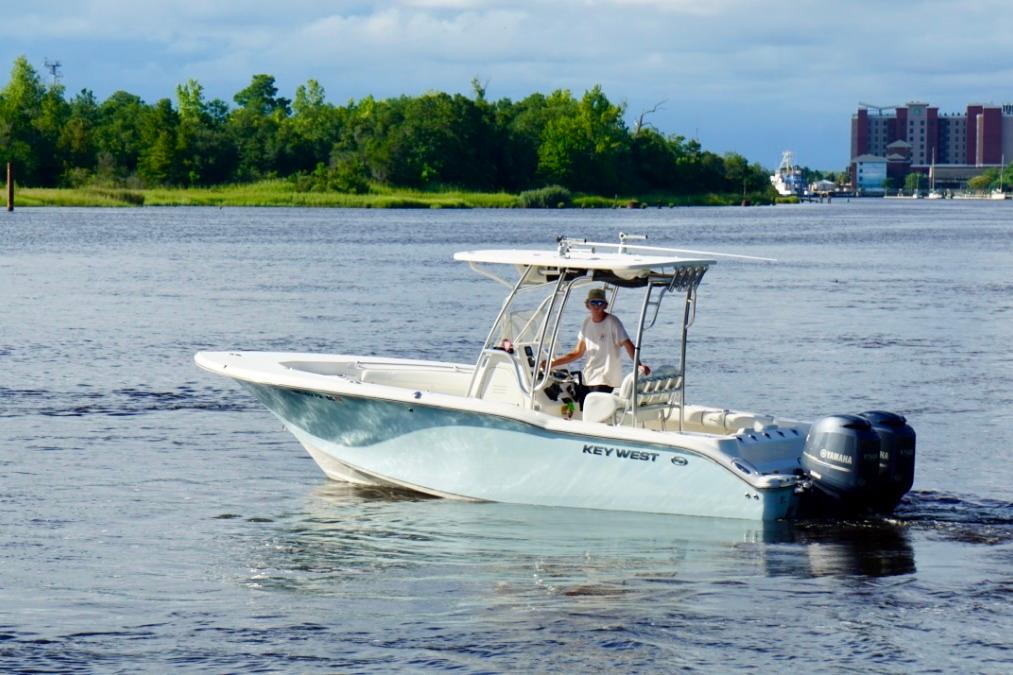 Key West 244 Center Console 2013 Key West 244 Center Console boat cruising on a scenic river.