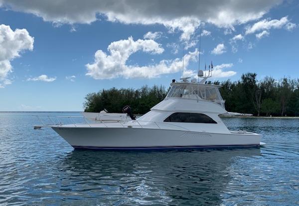 Viking 52 Convertible 2003 Viking 52 Convertible yacht on calm water with a scenic backdrop.