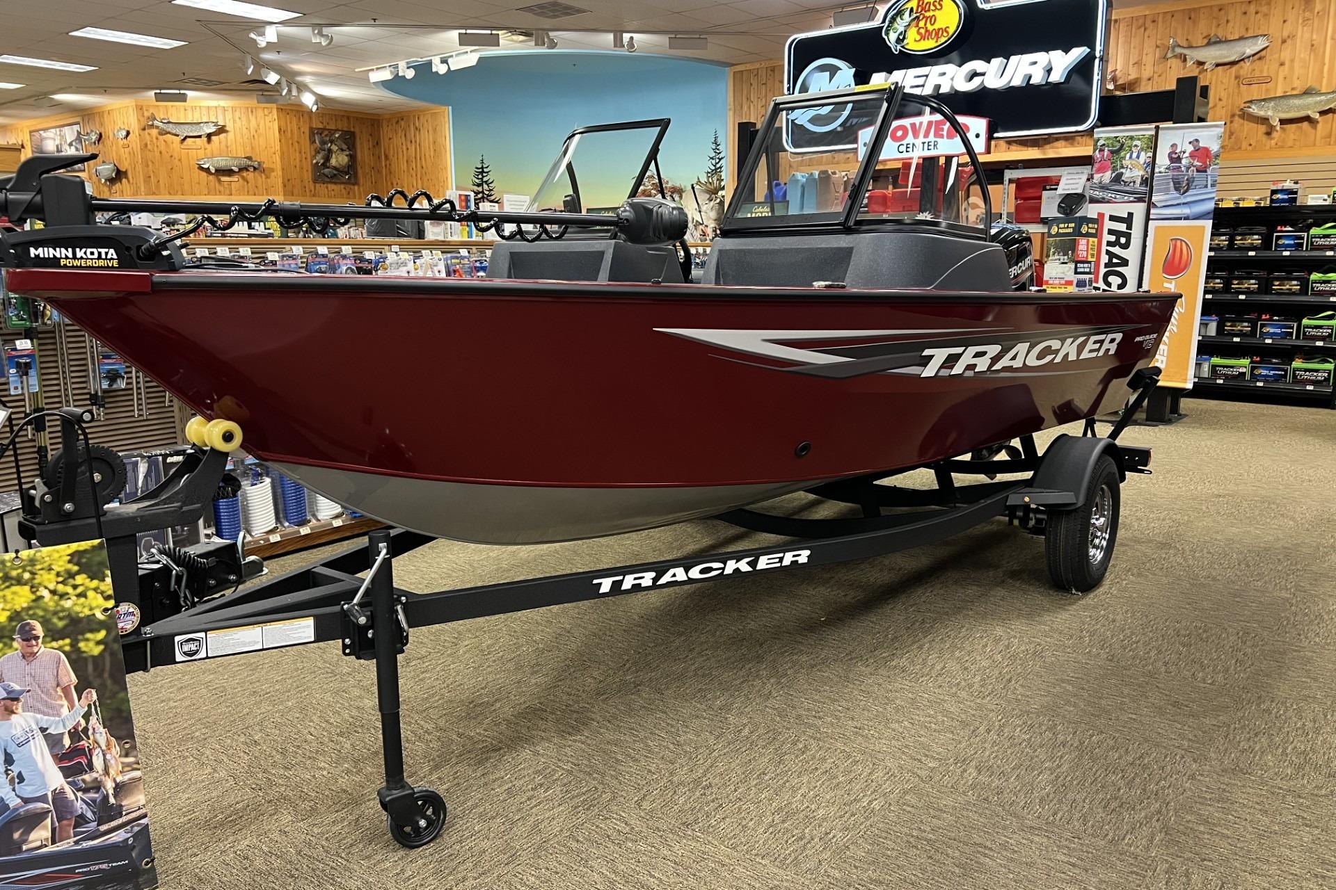 Tracker Pro Guide V-16 WT 2025 Tracker Pro Guide V-16 WT boat displayed in a showroom with accessories.