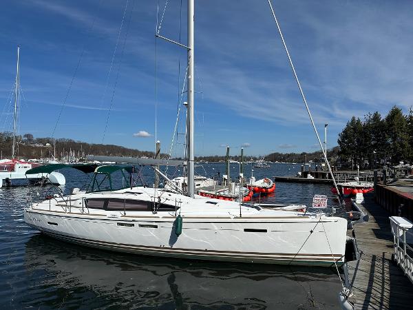 Jeanneau Sun Odyssey 44 DS 2017 Jeanneau Sun Odyssey 44 DS sailboat docked at a marina under clear blue skies.