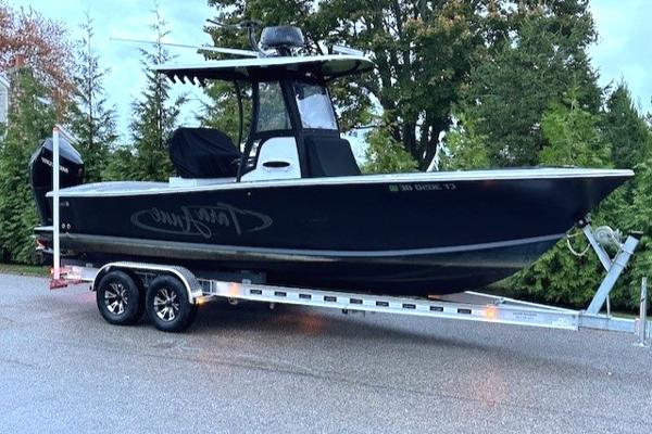 SeaCraft 23 Potter Hull 1975 SeaCraft 23 Potter Hull boat on trailer, parked outdoors.