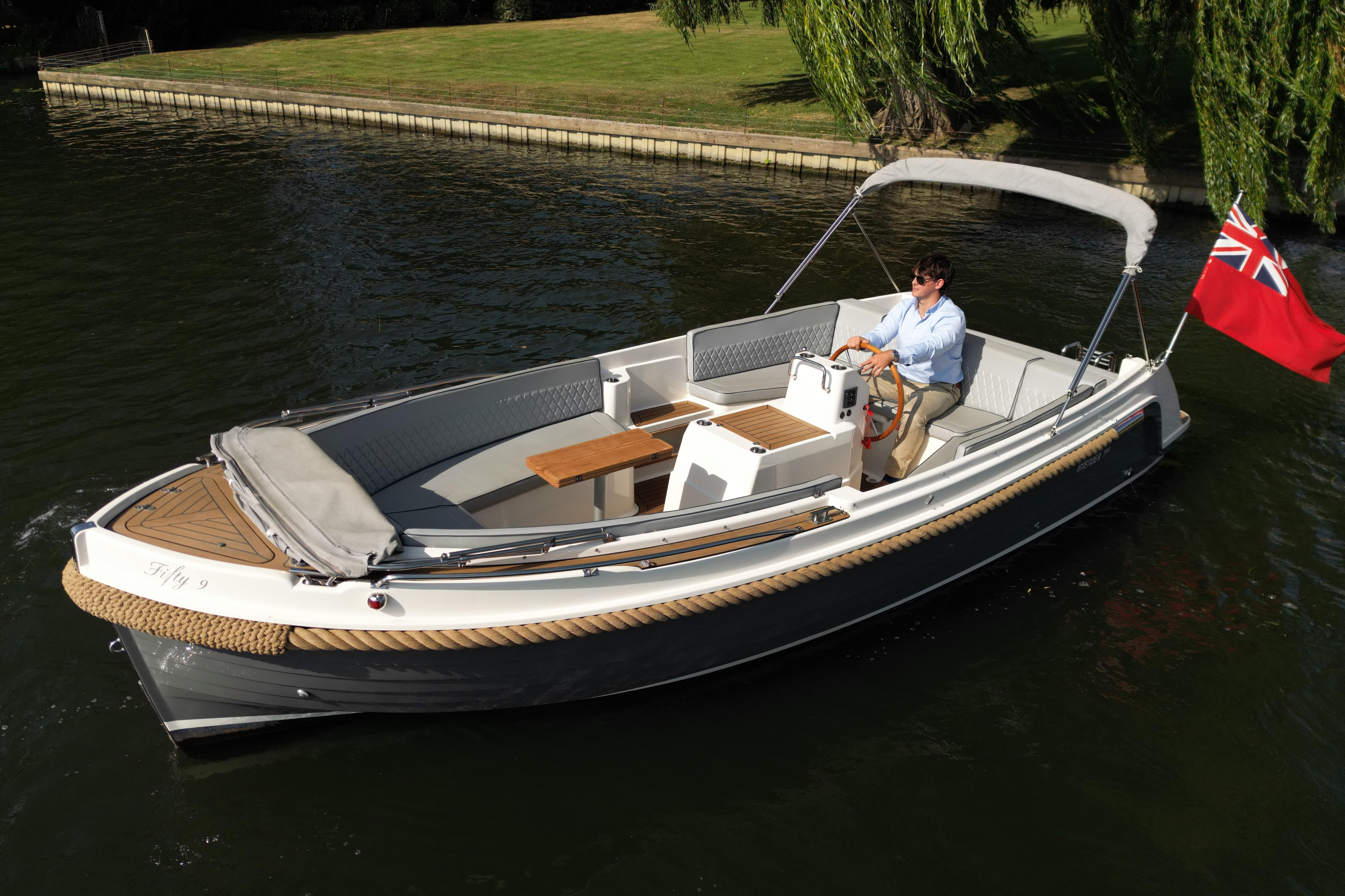 Interboat Intender 700 2019 Interboat Intender 700 cruising on a calm river with a red flag displayed.