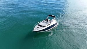 Regal 2860 Window Express 2008 Regal 2860 Window Express boat cruising on clear blue water.