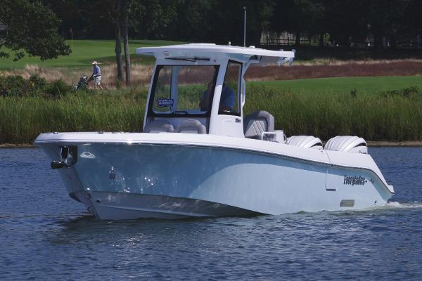 Everglades 285 Center Console 2025 Everglades 285 Center Console boat cruising on a calm lake.