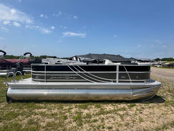 South Bay 220RSLE 2025 South Bay 220RSLE pontoon boat on display outdoors.