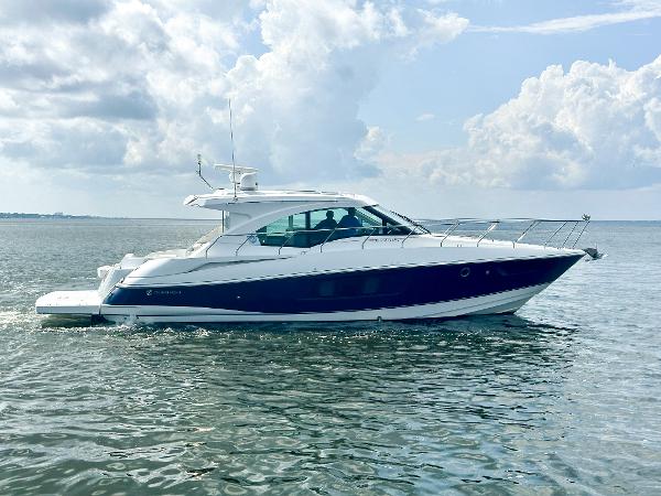 Cruisers Yachts Cantius 45 2016 Cruisers Yachts Cantius 45 cruising on open water under a cloudy sky.