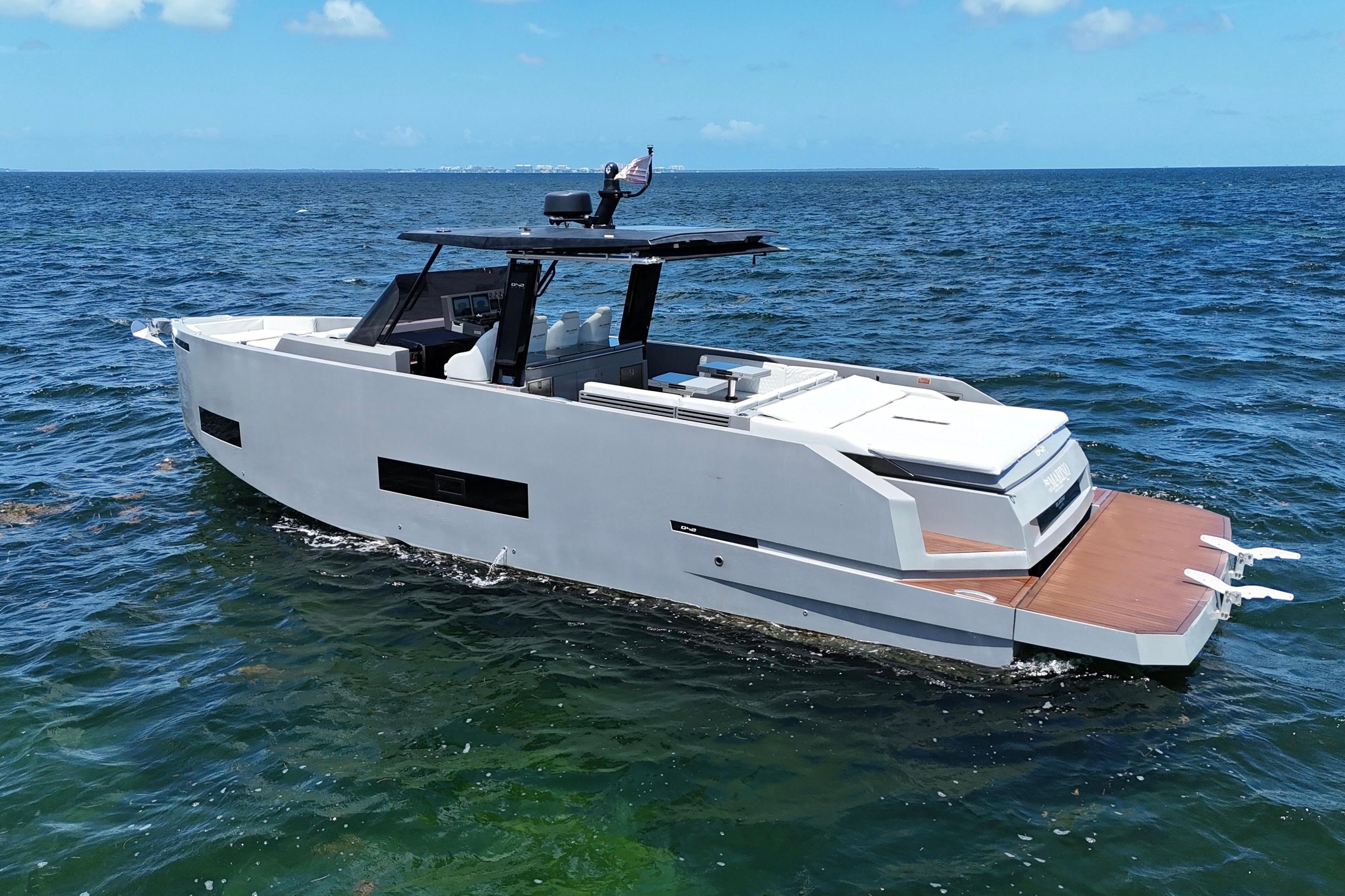 De Antonio Yachts D42 2025 De Antonio Yachts D42 cruising on open water under clear blue skies.