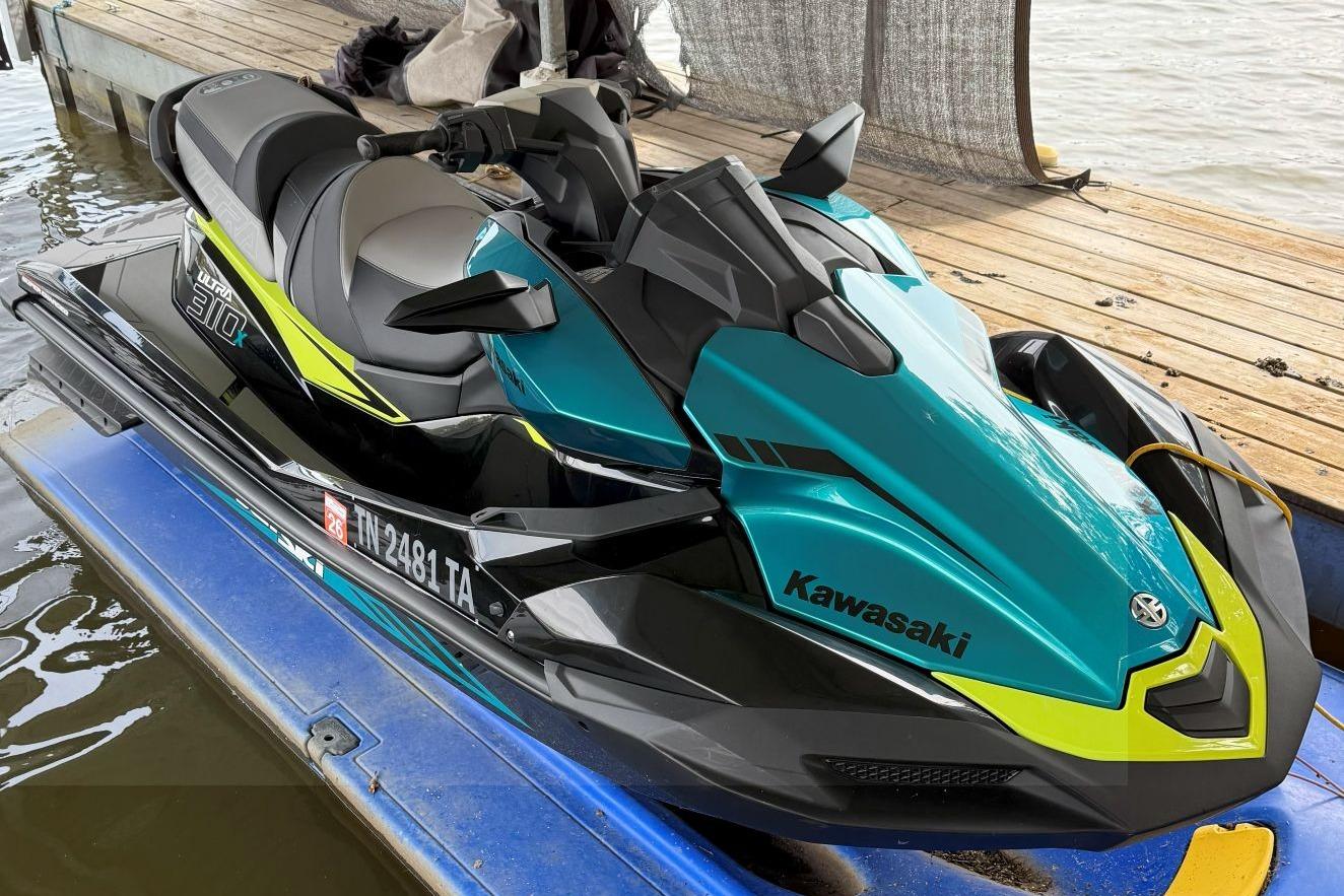 Kawasaki Jetski Ultra 310X 2023 Kawasaki Jetski Ultra 310X on dock, vibrant teal and black design.
