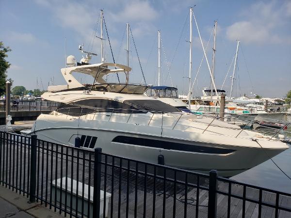 Sea Ray L590 Fly 2016 Sea Ray L590 Fly yacht docked at marina with sailboats in background.