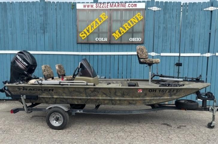 Tracker Grizzly 1648 SC 2018 Tracker Grizzly 1648 SC boat on trailer, parked in front of Sizzle Marine, Ohio.