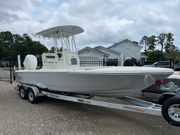 Pathfinder 2500 Hybrid 2024 Pathfinder 2500 Hybrid boat on trailer, white exterior, parked outdoors.