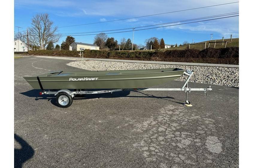 Polar Kraft 1436 Jon Boat, 14' long, 36" bottom, 15" transom w/ trailer 2024 Polar Kraft 1436 Jon Boat on trailer, parked outdoors on a sunny day.