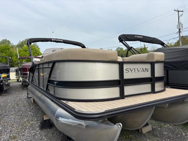 Sylvan X-3 CLZ 2025 Sylvan X-3 CLZ pontoon boat with sleek design, parked outdoors.