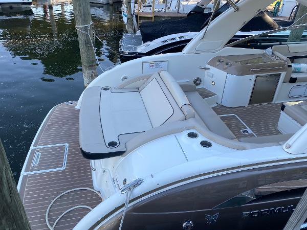 Formula 350 Sun Sport 2014 Formula 350 Sun Sport boat with spacious deck and seating at marina.