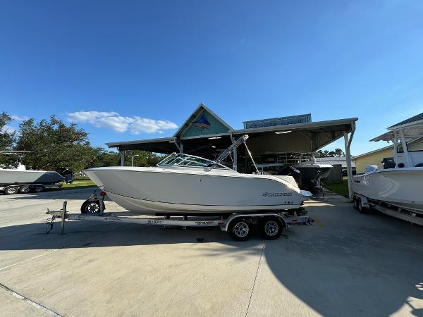 Sailfish 236 DC 2024 Sailfish 226 DC boat on trailer in sunny outdoor setting.