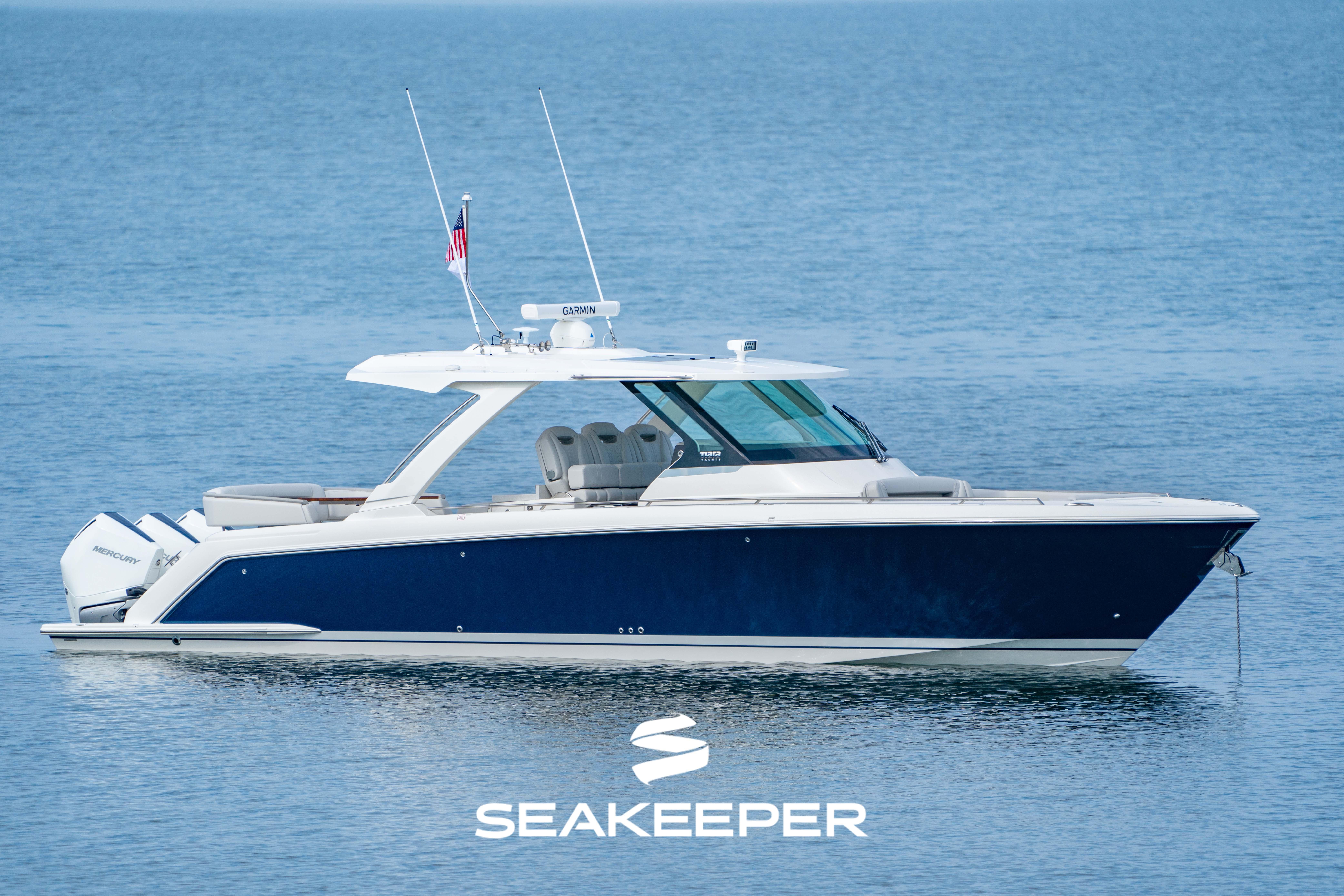 Tiara Yachts 38 LS 2023 Tiara Yachts 38 LS boat on calm water, featuring sleek design and modern amenities.