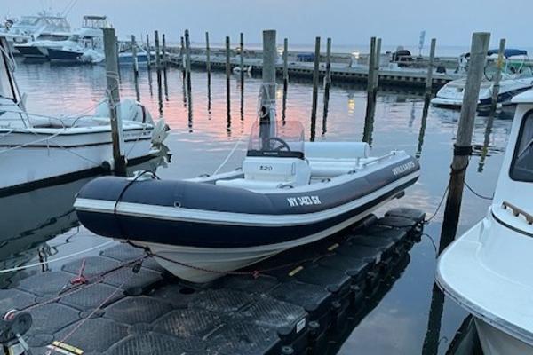 Williams Jet Tenders Sportjet 520 2017 Williams Jet Tenders Sportjet 520 docked at marina during sunset.