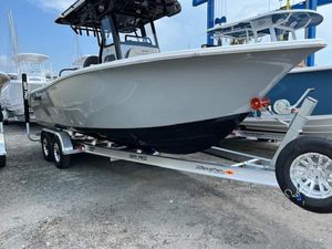 Sea Pro 245FLX Sandbar 2025 Sea Pro 245 FLX boat on trailer, displayed outdoors.