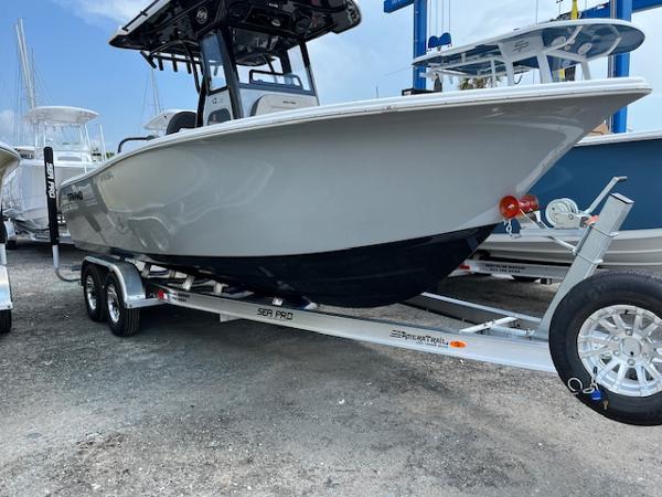 Sea Pro 245 FLX 2025 Sea Pro 245 FLX boat on trailer, displayed outdoors.