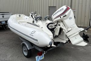 Zodiac Yachtline 360 2021 Zodiac Yachtline 360 inflatable boat with Evinrude motor on trailer.