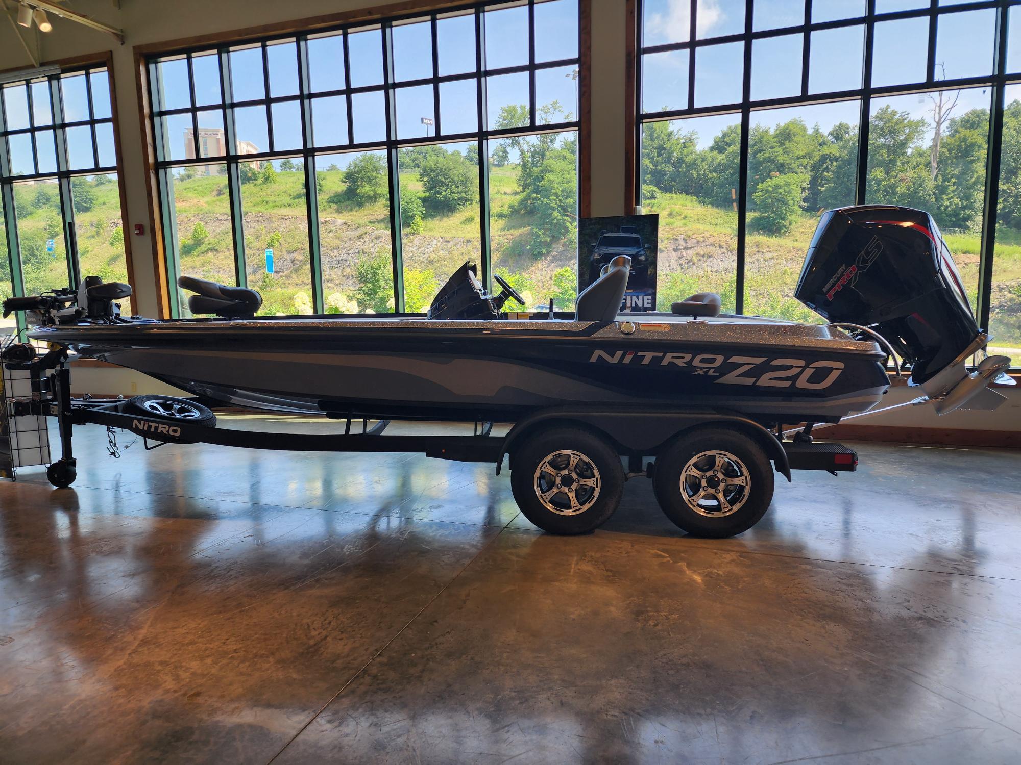 Nitro Z20 XL Pro 2026 Nitro Z20 XL Pro boat displayed indoors with large windows in the background.