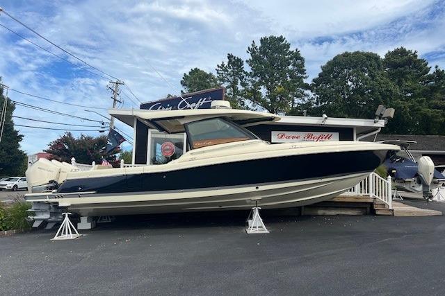 Chris-Craft Calypso 35 2024 Chris-Craft Calypso 35 boat displayed outdoors on stands.