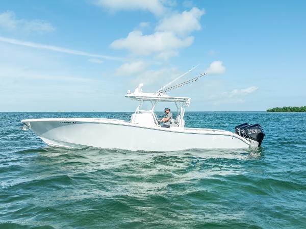 Yellowfin 34 2020 Yellowfin 34 boat cruising on open water under a clear blue sky.